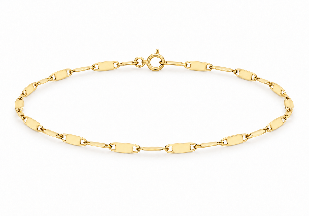 A yellow gold chain bracelet with elongated oval links and a spring-ring clasp, displayed on a clean white background.