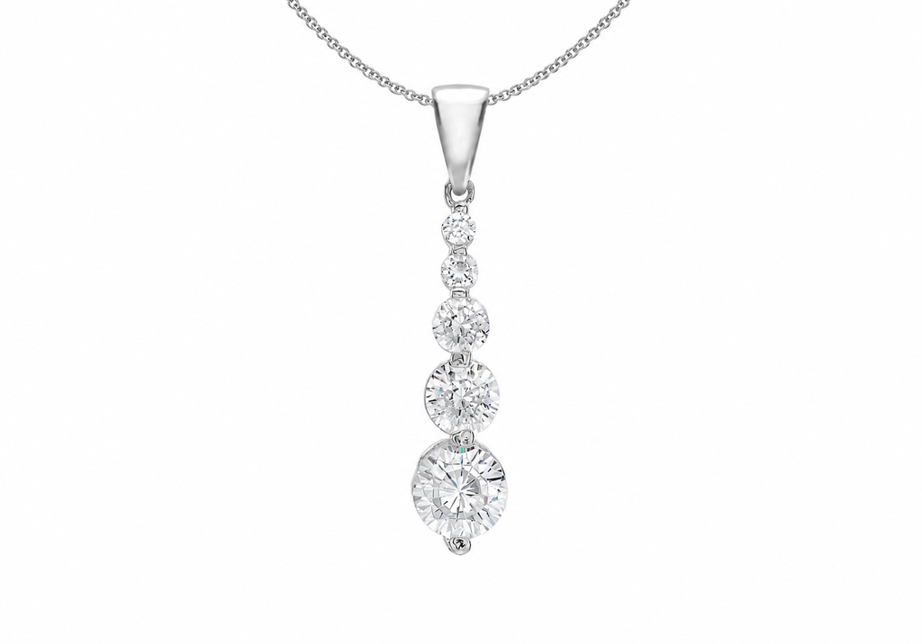A silver pendant necklace featuring a vertical drop design with four graduated round-cut clear gemstones, suspended from a delicate silver chain against a plain white background.