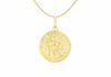 A gold Saint Christopher pendant necklace on a delicate gold chain, shown against a plain white background.