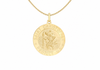 A gold Saint Christopher medal pendant necklace on a delicate gold chain, shown against a plain white background.