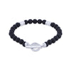 A beaded stretch bracelet featuring textured black lava stones and polished silver metal accents, including a toggle clasp, displayed on a clean white background.